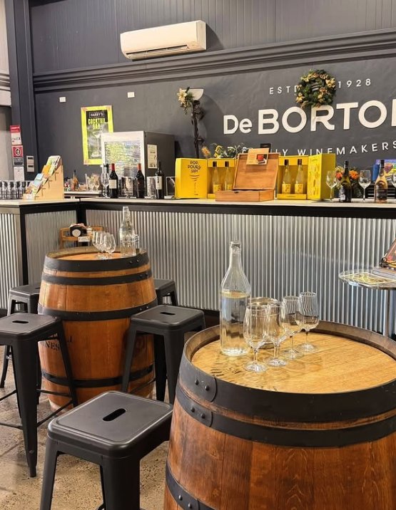 The De Bortoli tasting bar, established 1928, with barrel tables and stools